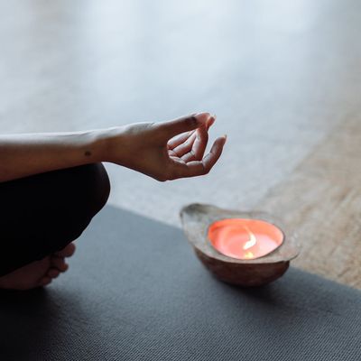 Close-up shot of hands in a specific yoga mudra.